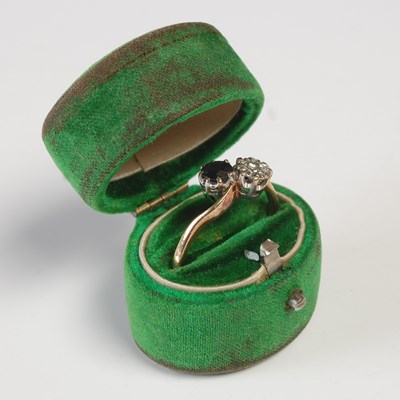 Lot 622 - A 9ct gold, diamond and sapphire two stone...