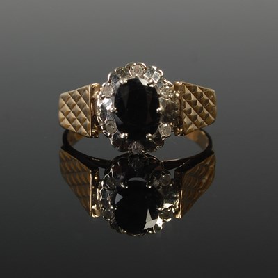 Lot 652 - A 9ct gold, sapphire and gem set cluster...
