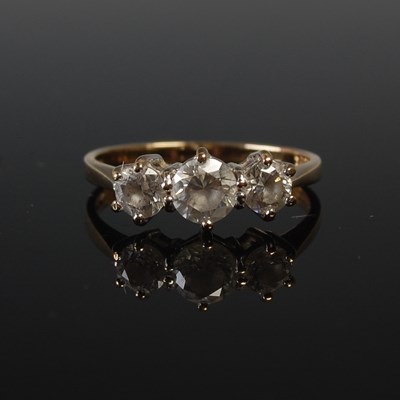 Lot 678 - A 15ct gold and diamond set three stone...