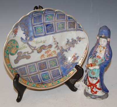 Lot 159 - A Japanese porcelain figure of a Guan Yin,...