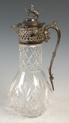 Lot 512 - An EP mounted cut glass claret jug, the hinged...