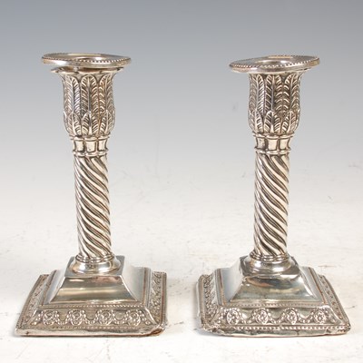 Lot 501 - A pair of Sheffield silver candlesticks, with...