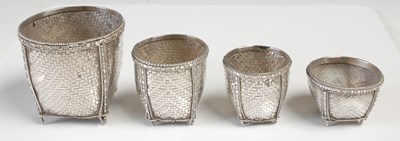 Lot 520 - A group of four assorted well-made white metal...