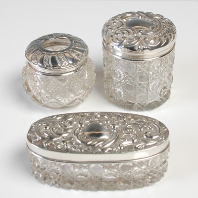 Lot 489 - Three assorted silver mounted cut glass toilet...