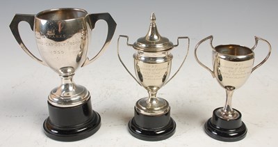 Lot 518 - A group of three various EPNS golfing trophies,...