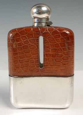 Lot 510 - A silver plated spirits flask with brown...