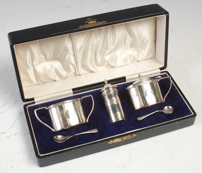 Lot 452 - A cased Birmingham silver three piece cruet...