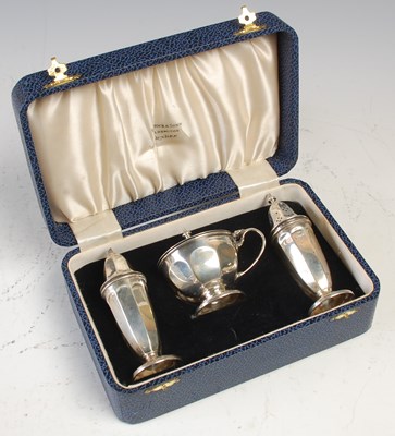 Lot 502 - A cased Sheffield silver three piece cruet set,...