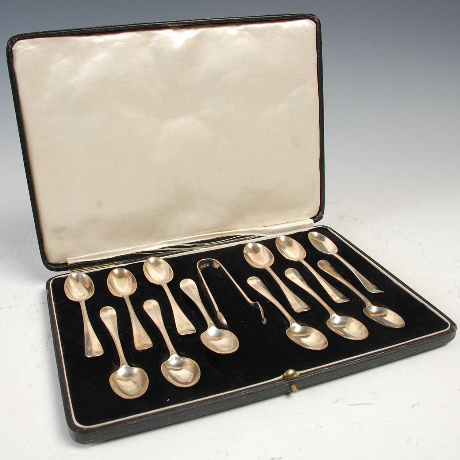Lot 464 - A cased set of twelve London silver tea spoons...