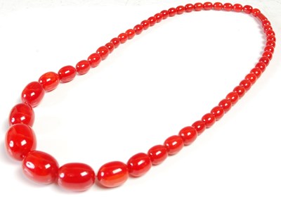 Lot 608 - A red amber type graduated bead...