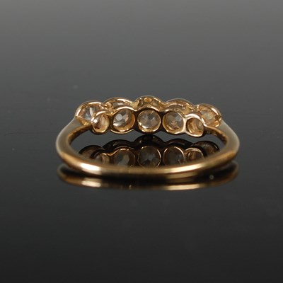 Lot 655 - A yellow metal and diamond five stone ring,...