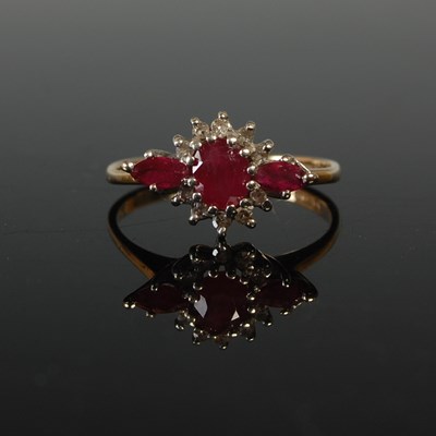Lot 581 - A 9ct gold, ruby and diamond dress ring, size...
