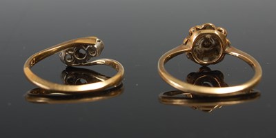 Lot 634 - Two yellow metal gem set dress rings, gross...