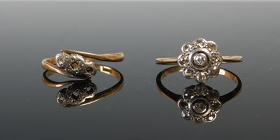 Lot 634 - Two yellow metal gem set dress rings, gross...