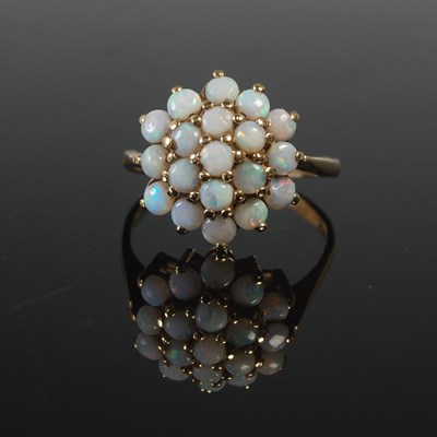 Lot 594 - A 9ct gold and opal cluster ring, size T,...