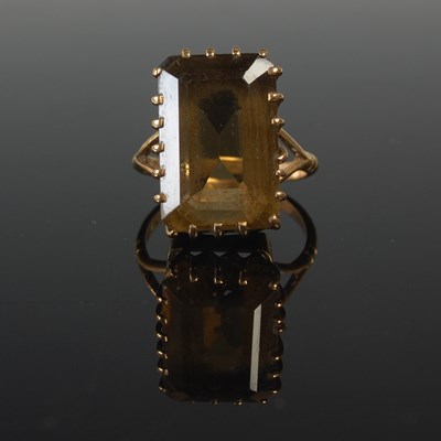 Lot 663 - A yellow metal and Cairngorm set single stone...