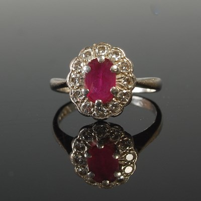 Lot 577 - A white metal, ruby and diamond cluster...