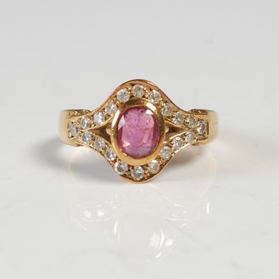 Lot 545 - A yellow metal, ruby and gem set cocktail ring,...