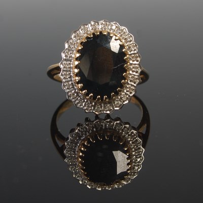 Lot 539 - A 9ct gold, sapphire and gem set cluster ring,...