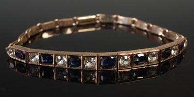 Lot 551 - A yellow metal, sapphire and gem set...