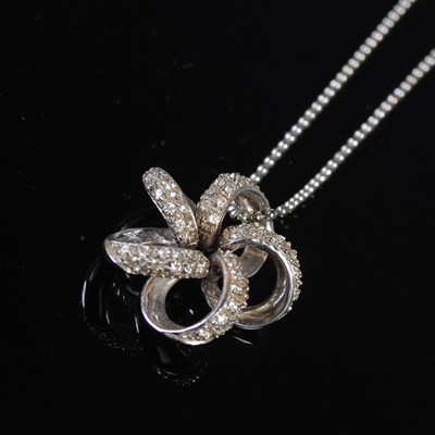 Lot 606 - A white metal and gem set pendant and...