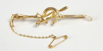 Lot 656 - A 9ct gold bar brooch in the form of a riding...