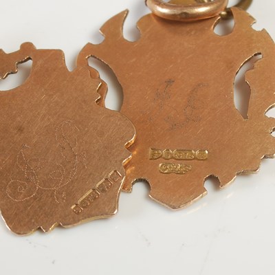 Lot 639 - Two 9ct gold shield shaped pendants, gross...