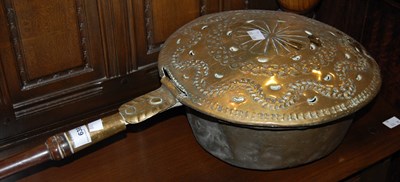 Lot 638 - An antique brass bed warming pan with turned...