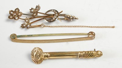 Lot 599 - A group of three yellow metal brooches, to...
