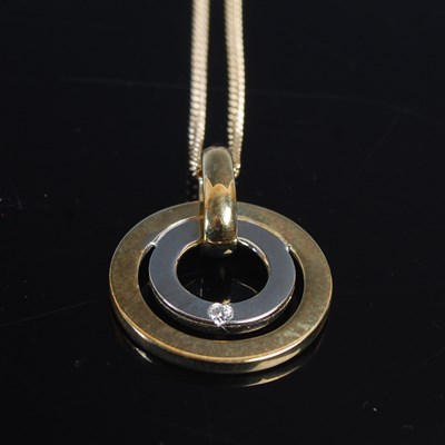 Lot 654 - A 9ct gold necklace suspending yellow and...