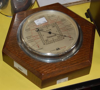 Lot 351 - An oak hexagonal barometer by S&M, model...