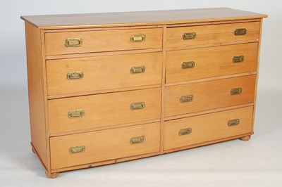 Lot 119 - A pine chest of eight drawers, all with...