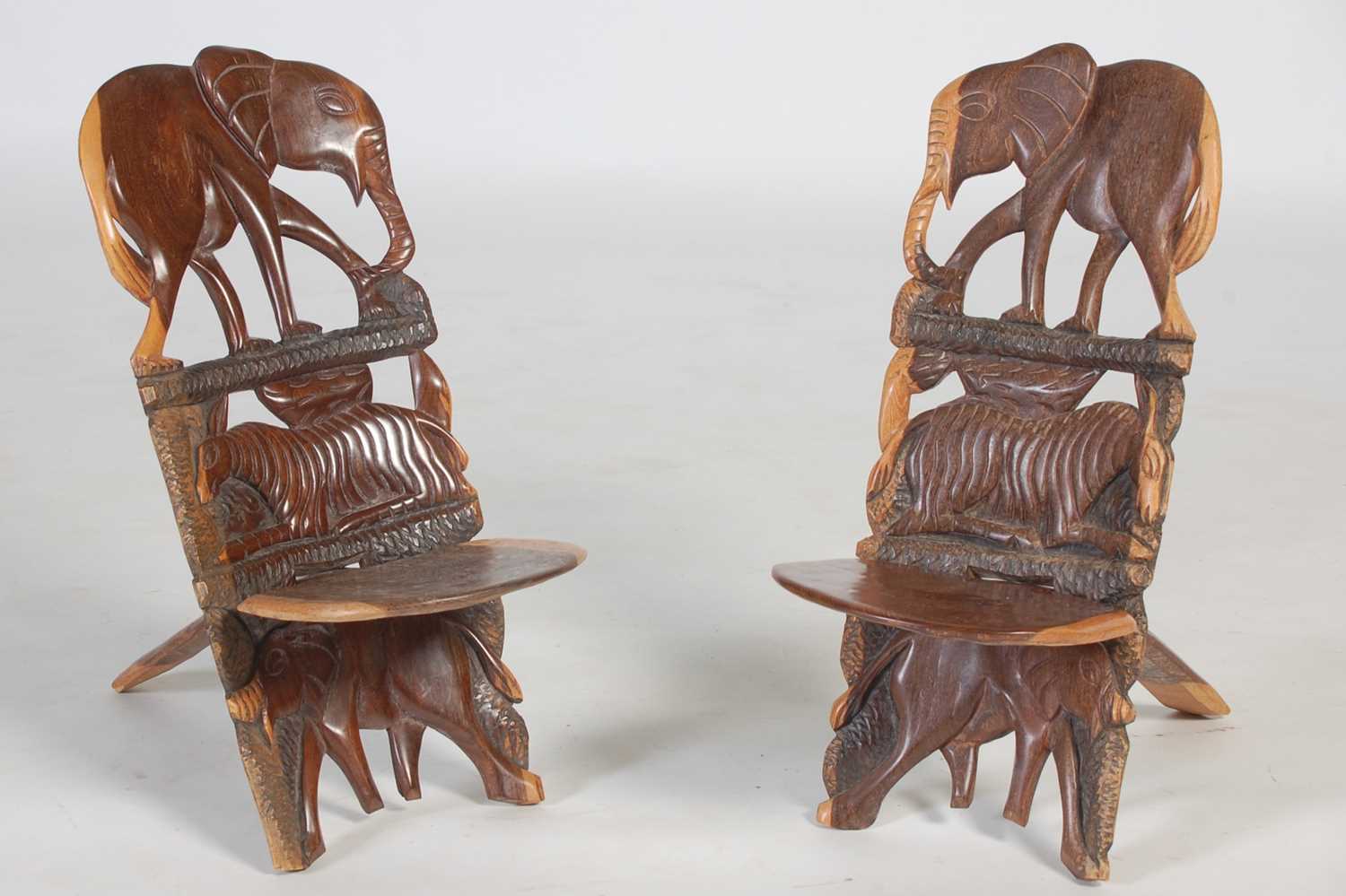 Lot 32 - A pair of African carved and pierced wood...