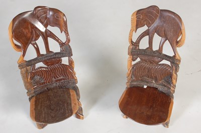 Lot 32 - A pair of African carved and pierced wood...