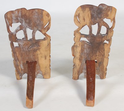 Lot 32 - A pair of African carved and pierced wood...
