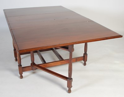 Lot 5 - An early 20th century drop-leaf dining table,...