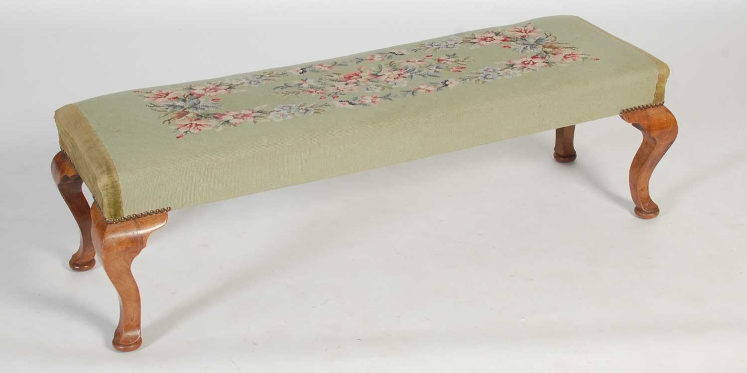 Lot 20 - An early 20th century green ground needlework...