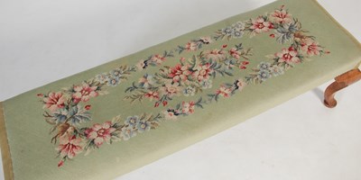 Lot 20 - An early 20th century green ground needlework...