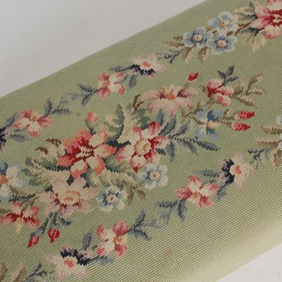 Lot 20 - An early 20th century green ground needlework...