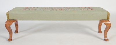 Lot 20 - An early 20th century green ground needlework...