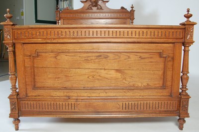 Lot 60 - An early 20th century oak double bed, the...