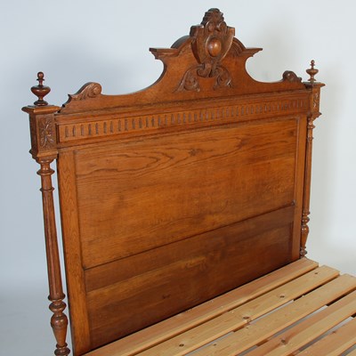 Lot 60 - An early 20th century oak double bed, the...