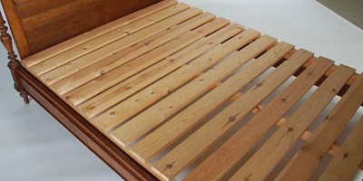 Lot 60 - An early 20th century oak double bed, the...