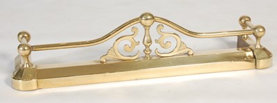 Lot 241 - A small sized brass fire fender, with upright...