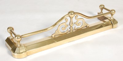 Lot 241 - A small sized brass fire fender, with upright...