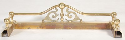 Lot 241 - A small sized brass fire fender, with upright...
