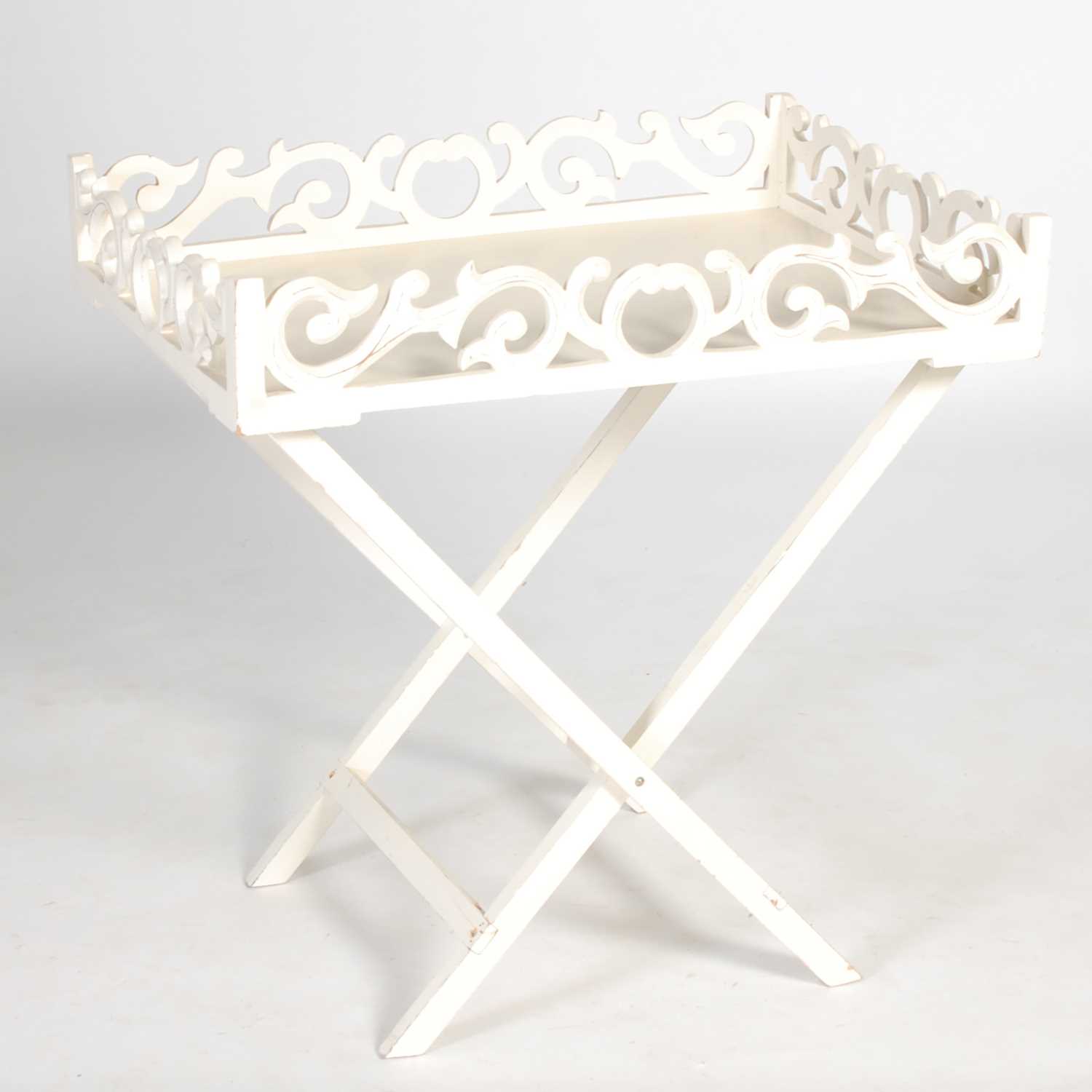 Lot 88 - A white painted tray on X-frame stand, the...