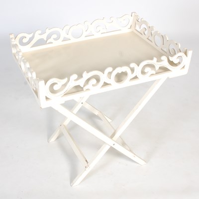 Lot 88 - A white painted tray on X-frame stand, the...