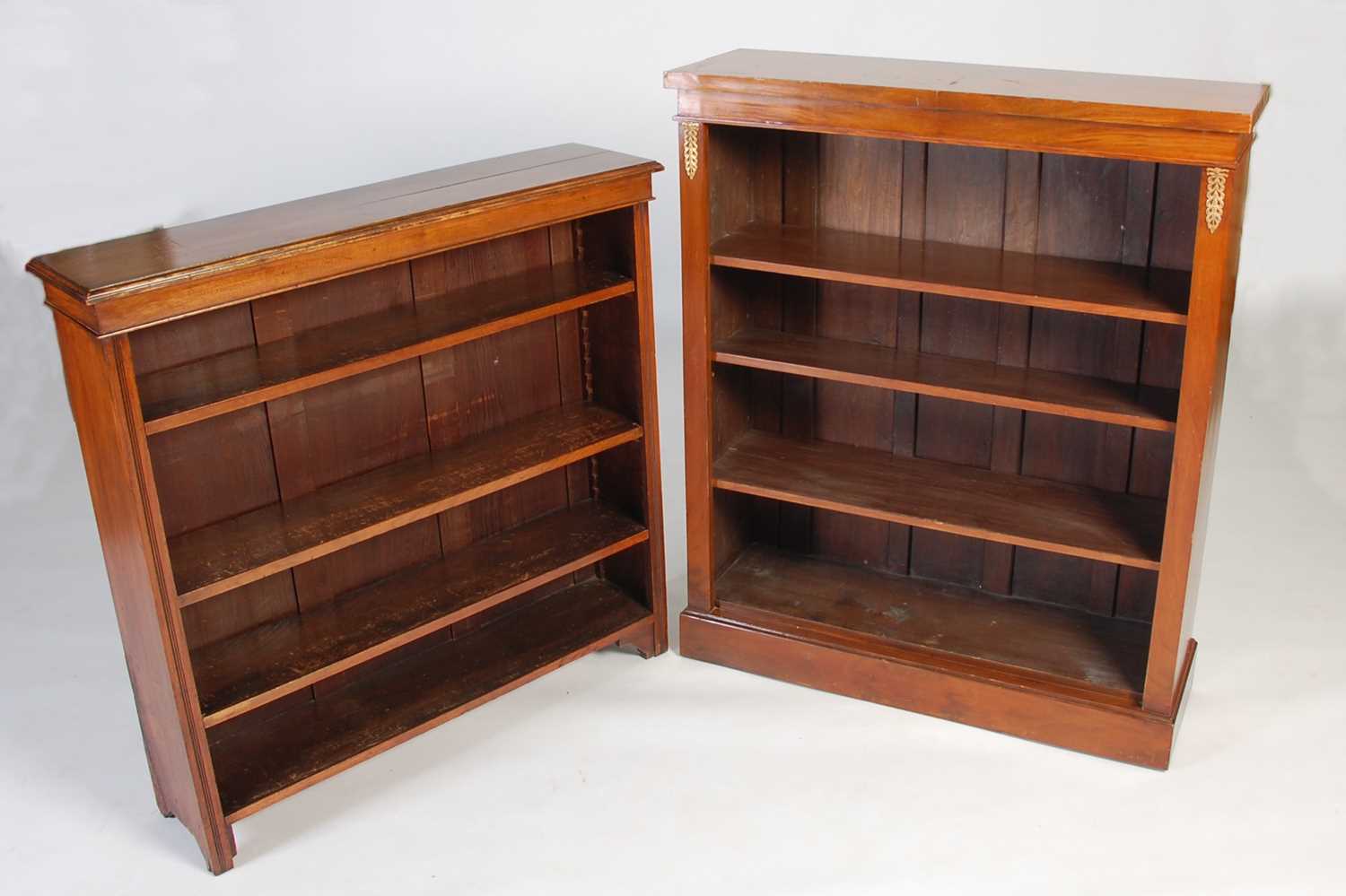 Lot 23 - A walnut open bookcase, with applied gilt...