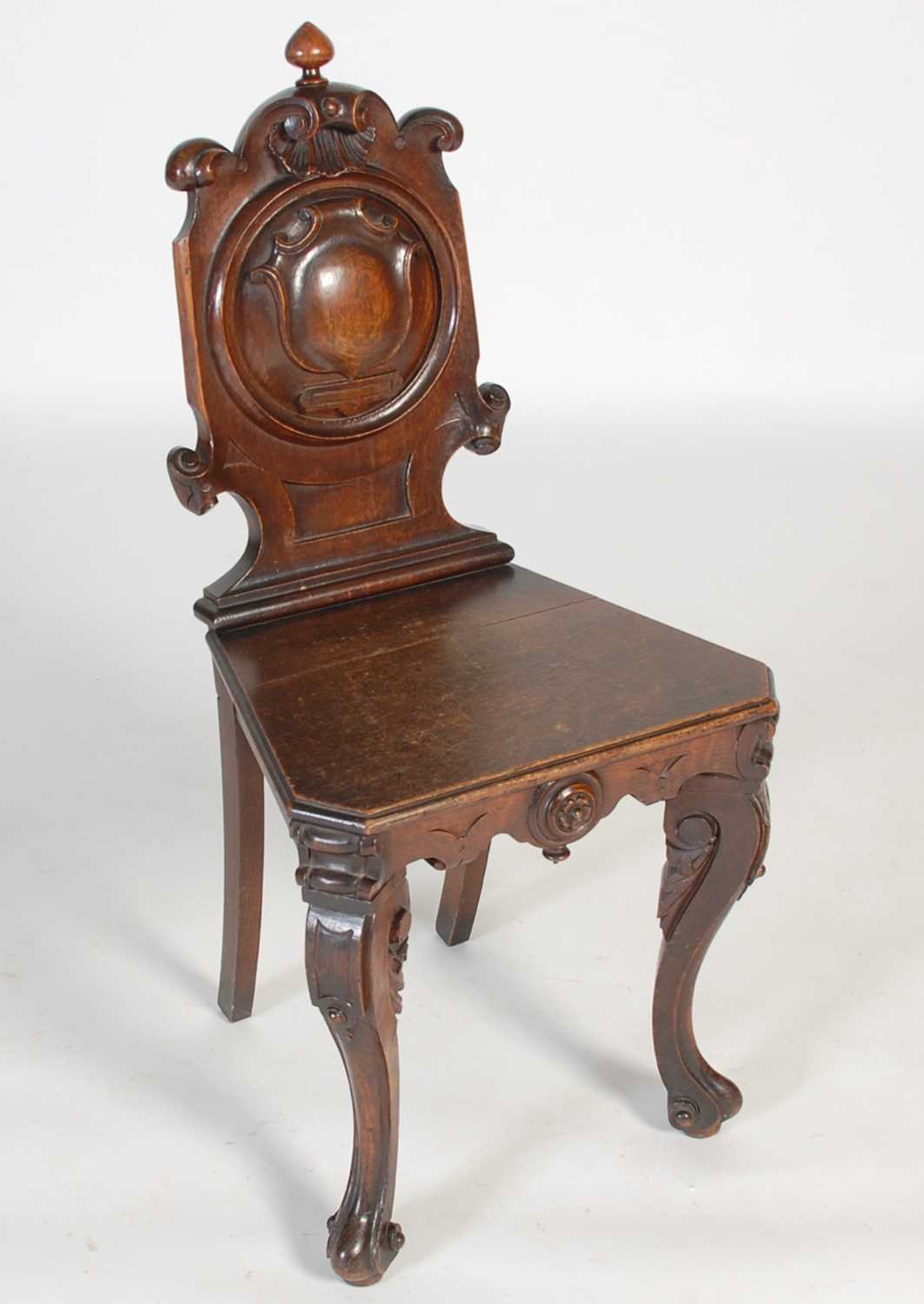 Lot 46 - A Victorian stained oak hall chair, the...